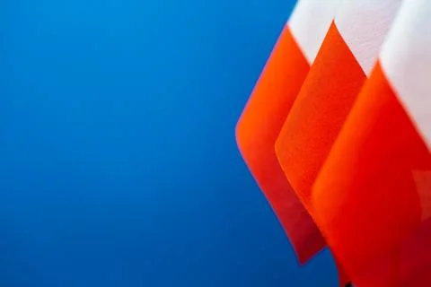 Flags of Poland with blue background empty space for your text on left. Stock Photos
