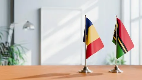 FLAGS OF ROMANIA AND VANUATU ON TABLE Stock Photos