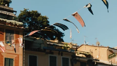Flags On The Rope Against Old Stone Building. Stock-Footage 107411973