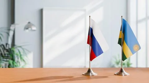 FLAGS OF RUSSIA AND RWANDA ON TABLE Stock Photos