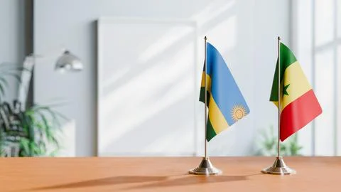 FLAGS OF RWANDA AND SENEGAL ON TABLE Stock Photos