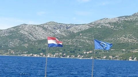 Flags on Sea Coast Stock Footage 54902539