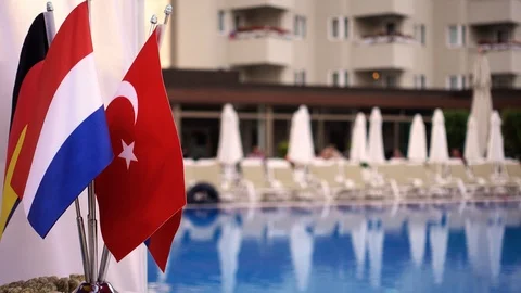 Flags of several countries on the background of the pool. In the background,  Stock-Footage 91718987