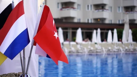 Flags of several countries on the background of the pool. Video stock 92344337