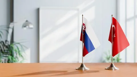 FLAGS OF SLOVAKIA AND TURKEY ON TABLE Stock Photos