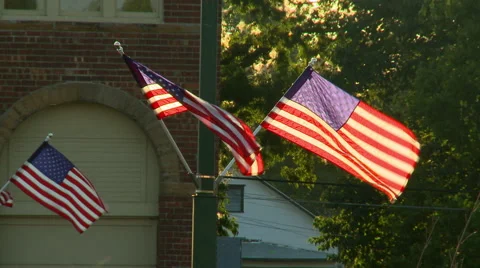 Flags in small town summer sun Video stock 54622301