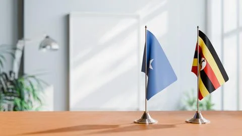 FLAGS OF SOMALIA AND UGANDA ON TABLE Stock Photos
