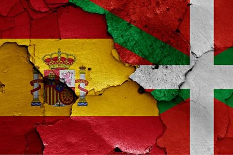 Flags of Spain and Basque country painted on cracked wall Stock Photos