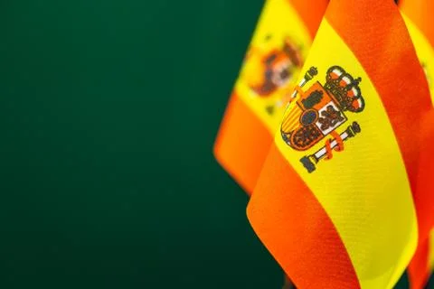Flags of Spain with green background empty space for your text on left. Stock Photos