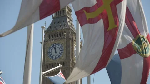 Flags of St George and Big Ben Clocktower in Parliament Square, London, England Stock Footage 243036015