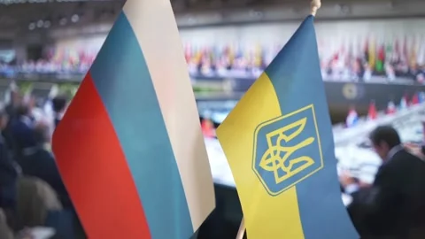 Flags of states. Peace summit on issues of Russia and Ukraine. Peace agreements. Stock Footage 285862010