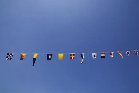 Flags on a string Stock Photos