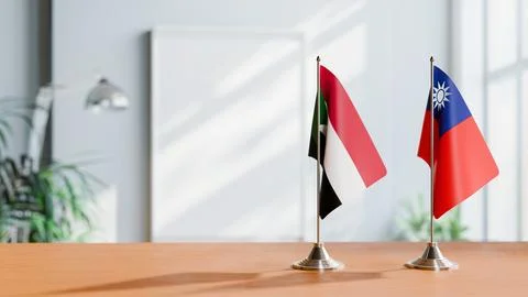 FLAGS OF SUDAN AND TAIWAN ON TABLE Stock Photos