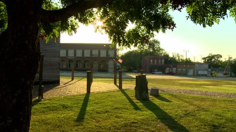 Flags at sunset in Small Town Stock Footage 54637817