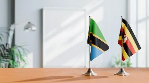 FLAGS OF TANZANIA AND UGANDA ON TABLE Stock Photos