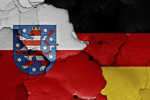 Flags of Thuringia and Germany painted on cracked wall Stock Illustration