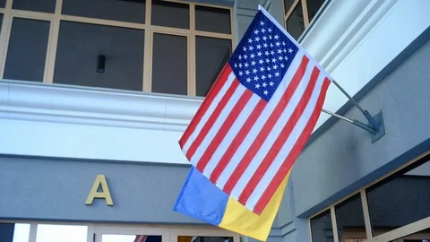 Flags of two countries flutter in the wind Video stock 128267990