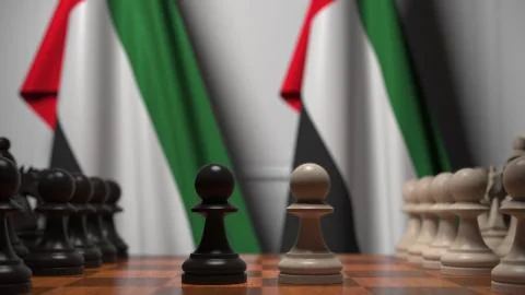 Flags of UAE behind pawns on the chessboard. Chess game or political rivalry Stock Illustration