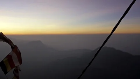 Flags under Adam's Peak in Sri Lanka Stock Footage 73288644