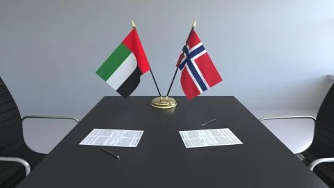 Flags of the United Arab Emirates UAE and Norway and papers on the table 스톡 일러스트