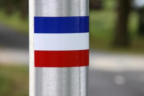 Flags upside down and protest signs on lightning pole in Moordrecht with pr.. Stock Photos