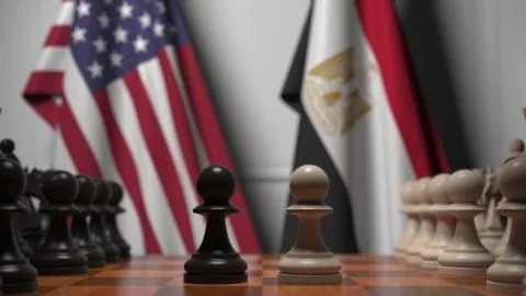 Flags of USA and Egypt behind pawns on the chessboard. Chess game or political Stock Illustration