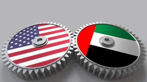 Flags of the USA and the UAE on meshing gears. International cooperation Stock Footage 87305727