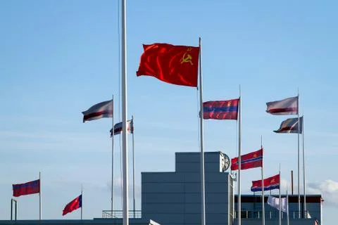 Flags of the USSR and Soviet republics on the background of blue sky Stock Photos