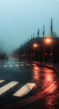 The flags of various countries in front of a building with the reflection of  Fotos de archivo
