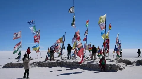 Flags of various nations on the Uyuni Salt Flats, Bolivia Stock Footage 153593151