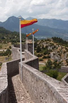 Flags on the wall of citadel. Stock Photos
