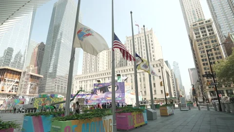 Flags wave at half-mast at the World Trade Center transit hub in New York City Vídeos de archivo 181211725