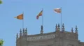 Flags waving on the Bank of Spain building in Barcelona 4k or 4k+ Resolution