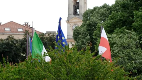 Flags waving. City of ivrea background. Italy. Europe. 库存影片 164206628