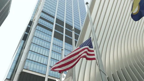 Flags waving at half mast at the World Trade Center Oculus Vídeos de archivo 181212897