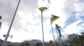 Flags waving at the Middle of the World Monument in Ecuador 4k or 4k+ Resolution