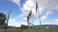 Flags waving in the Middle of the World museum park in Ecuador 4k or 4k+ Resolution