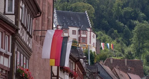 Flags waving in Miltenberg with half-timbered houses, Germany 4K Stock Footage 119212853