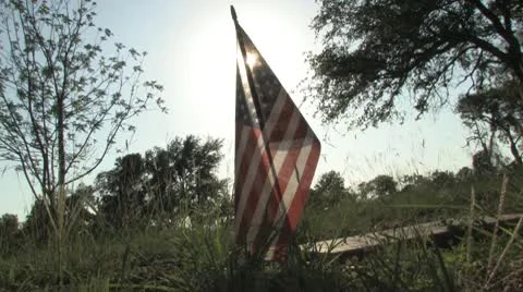 Flags waving over graves at Antioch Colony Cemterery Stock Footage 10571766