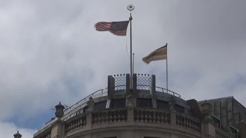 Flags waving on top of building Video stock 82367159