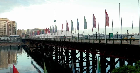 Flags in wind across pedestrian bridge Stock Footage 88703007