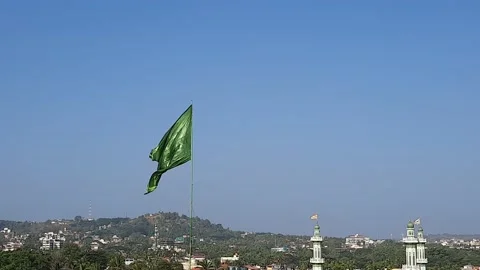 Flags on the wind, green color flag in the flowing over blue sky. Stock Footage 157613813
