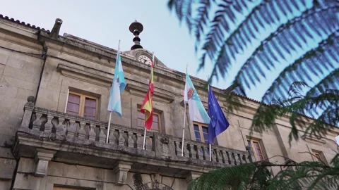 Flags in the wind at Plaza de la Inmaculada Tui Spain Video stock 279735121