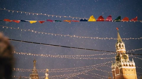 Flags on wind, Red Square, Russia. Snowy weather Christmas night, New Year Stock Footage 219993856