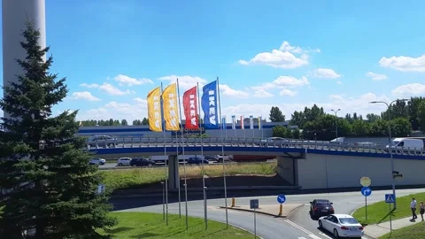 Flags with word IKEA waving against backdrop of interchange junction. Stock Footage 247921646