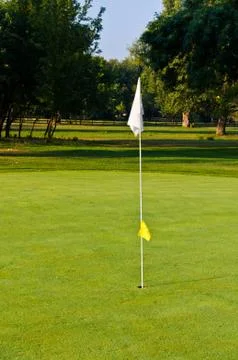 Flagstick at golf course, Ada river island, Belgrade, Serbia Stock Photos
