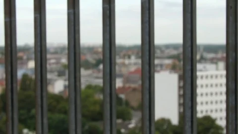 Flak Tower – View through fence on Berlin skyline with plane 動画素材 79996973