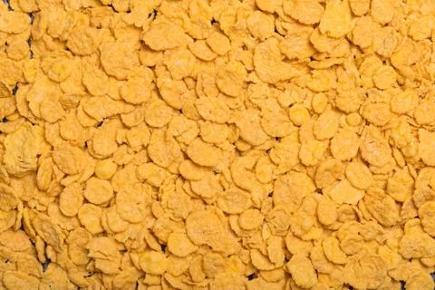 Flakes scattered on the background. Cornflakes. Background for text. Backgrou Fotos Stock