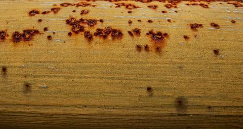 Flaking yellow paint on rusty surface Stock Photos