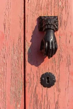Flaky paint on old door with rusty handle Photos